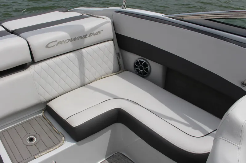 Slide: The Image of 2022 Crownline 240 SS boat interior with cushioned seating and speaker detail. - 8