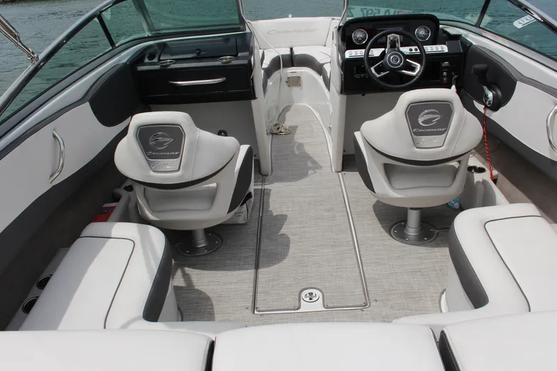 Slide: The Image of Interior of 2022 Crownline 240 SS boat with modern seating and dashboard. - 9