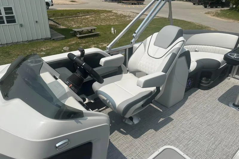 Slide: The Image of 2025 Tahoe 2185 boat interior with modern helm and comfortable seating. - 11