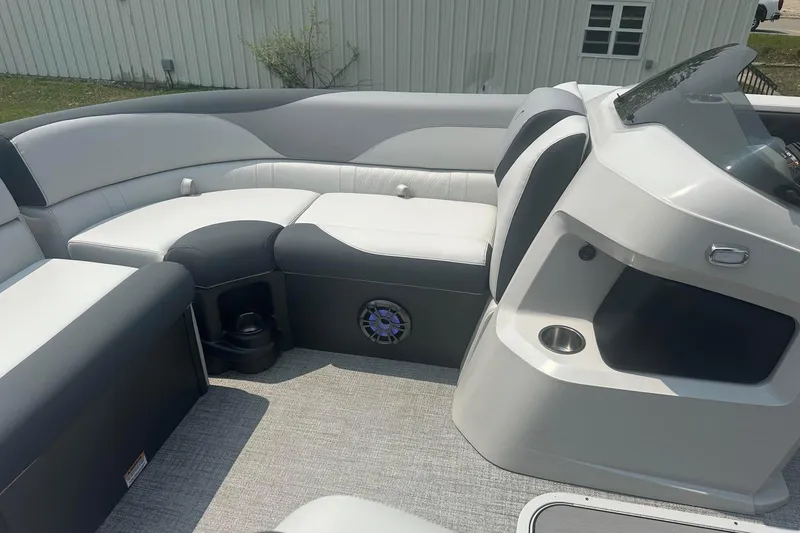 Slide: The Image of 2025 Tahoe 2185 boat interior with sleek seating and modern dashboard design. - 12