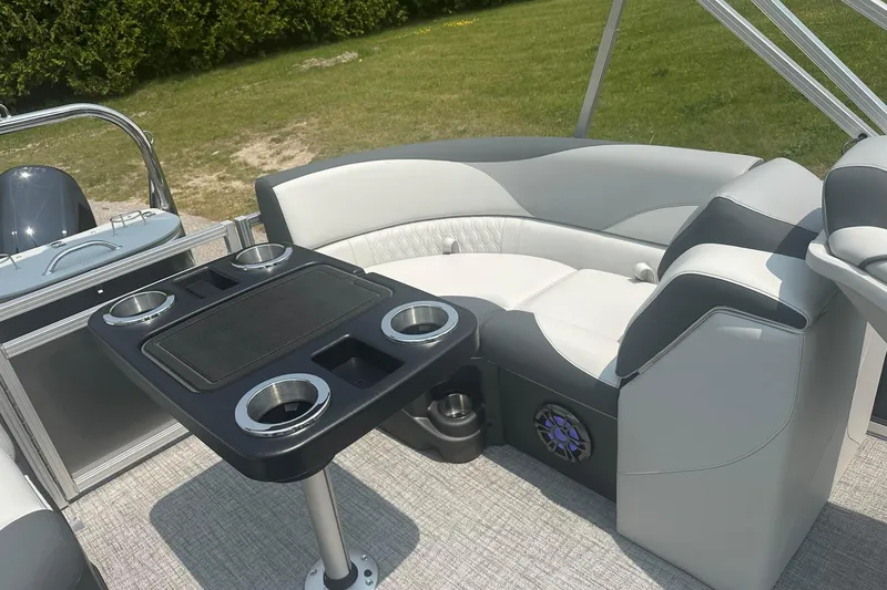 Slide: The Image of Luxurious seating area on 2025 Tahoe 2185 boat with cupholders and modern design. - 18