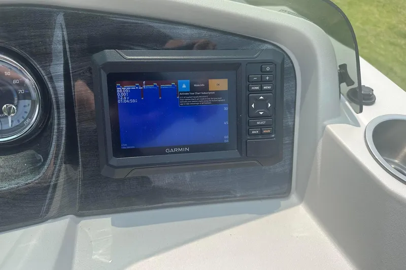 Slide: The Image of Garmin navigation display on 2025 Tahoe 2185 boat dashboard, showing speed and depth data. - 19