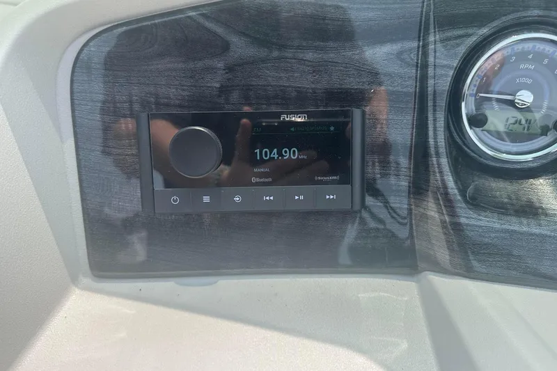 Slide: The Image of Dashboard of 2025 Tahoe 2185 with radio and RPM gauge. - 22