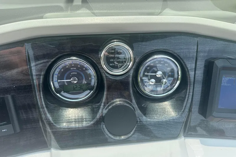 Slide: The Image of Dashboard of 2025 Tahoe 2185 with RPM and speed gauges. - 23