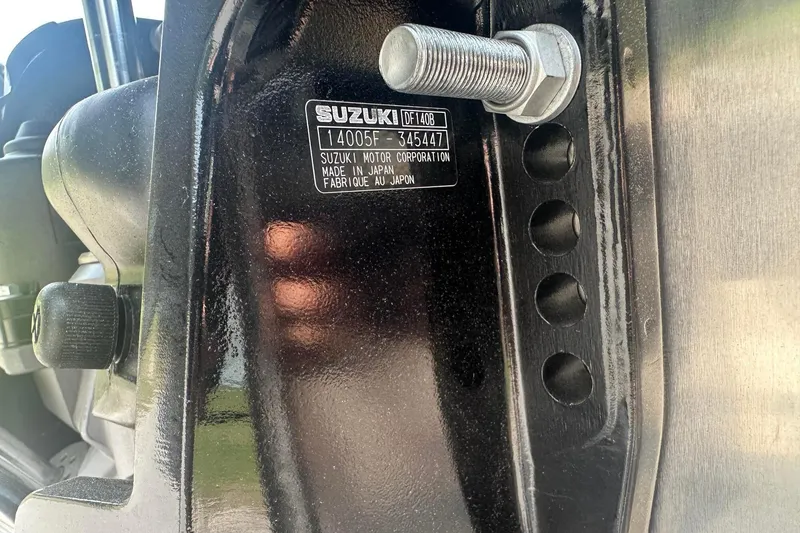 Slide: The Image of Close-up of a Suzuki motor label on a Tahoe 2185, 2025 model. - 26