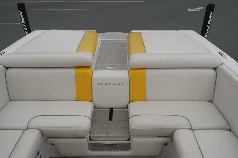 Slide: The Image of 2007 Correct Craft 236 Team Edition boat interior with white and yellow seating. - 13