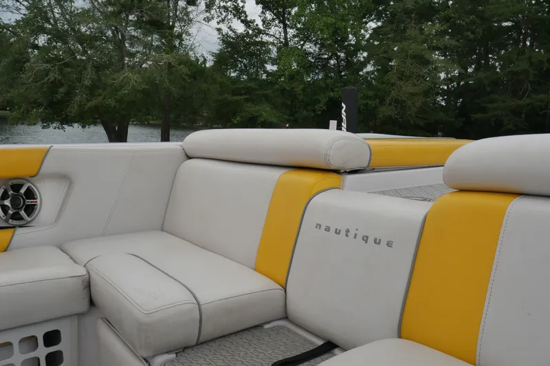 Slide: The Image of 2007 Correct Craft 236 Team Edition boat interior with yellow and white seating. - 14