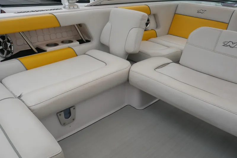 Slide: The Image of 2007 Correct Craft 236 Team Edition boat interior with white and yellow seating. - 17