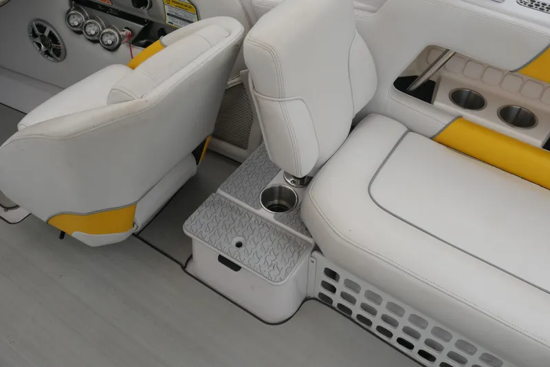 Slide: The Image of 2007 Correct Craft 236 Team Edition boat interior with white and yellow seating. - 21