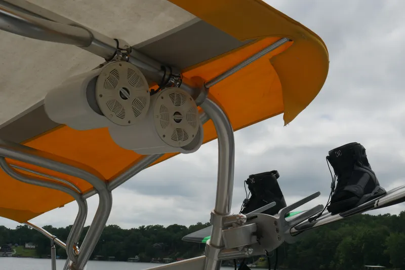 Slide: The Image of 2007 Correct Craft 236 Team Edition boat speakers and wakeboard boots under canopy. - 25