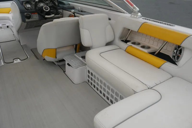 Slide: The Image of 2007 Correct Craft 236 Team Edition boat interior with white and yellow seating. - 26