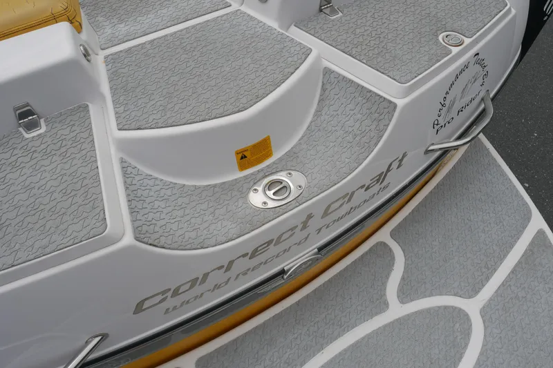 Slide: The Image of 2007 Correct Craft 236 Team Edition boat deck with textured gray surface. - 35