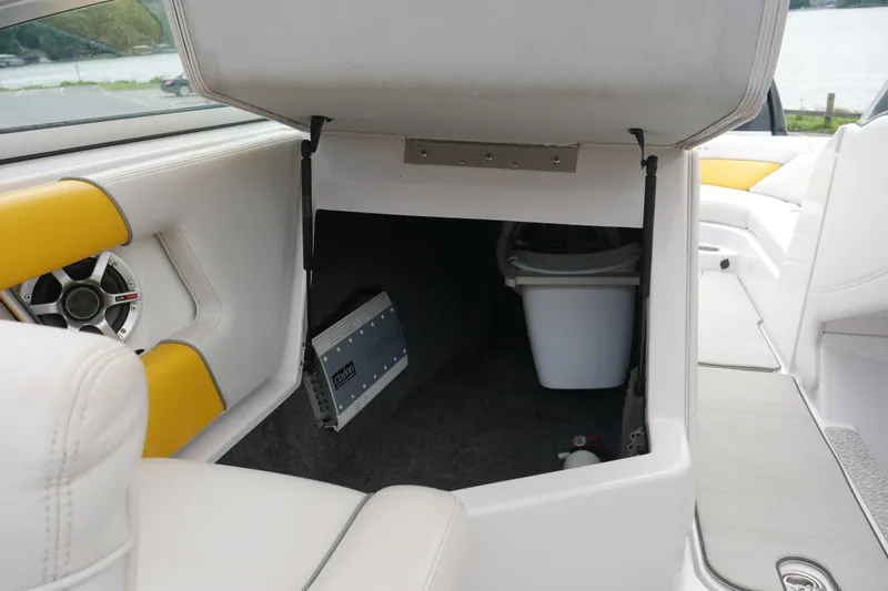 Slide: The Image of 2007 Correct Craft 236 Team Edition boat interior storage with speaker and amplifier. - 37