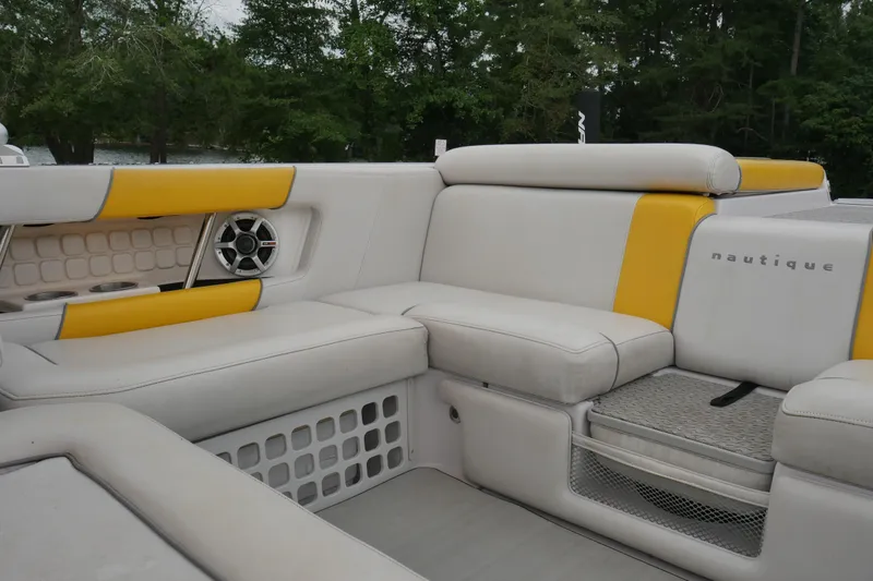 Slide: The Image of 2007 Correct Craft 236 Team Edition boat interior with yellow and white seating. - 7