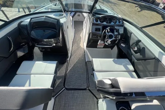 Slide: The Image of 2022 MONTERY 298 boat interior with modern seating and sleek dashboard design. - 3