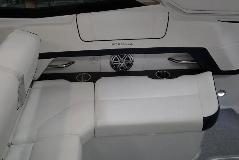 Slide: The Image of 2016 Formula 330 Crossover Bowrider cup holders and storage area in sunlight. - 13