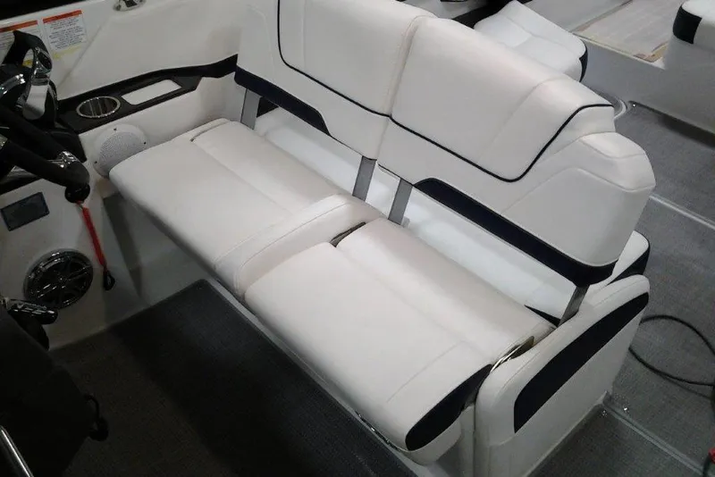 Slide: The Image of 2016 Formula 330 Crossover Bowrider interior with white leather seating and speaker system. - 14