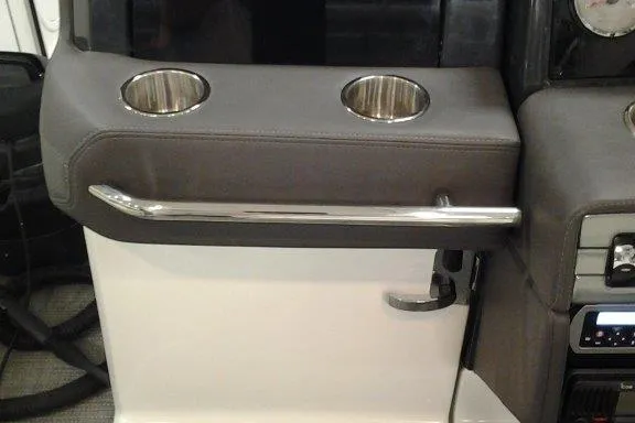 Slide: The Image of 2016 Formula 330 Crossover Bowrider cockpit with modern controls and plush seating. - 15