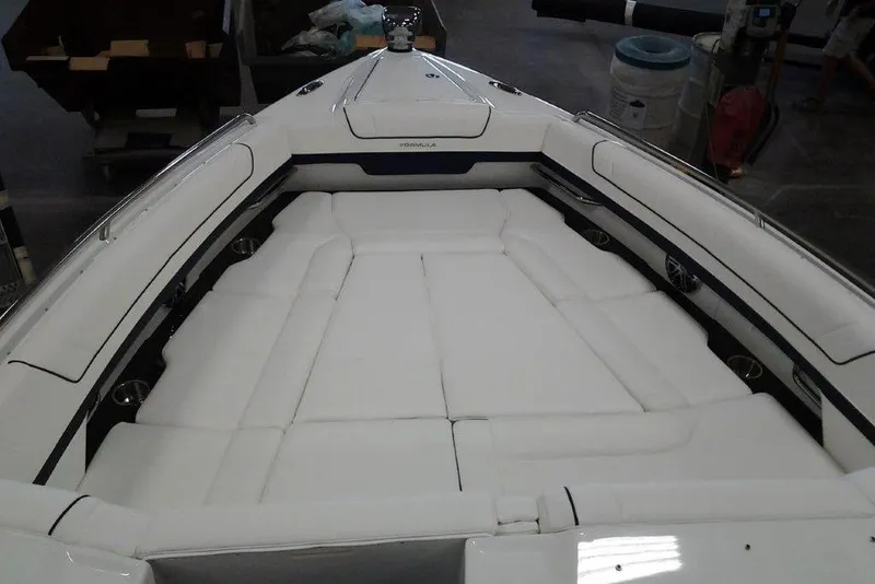 Slide: The Image of 2016 Formula 330 Crossover Bowrider boat, rear view, parked on a sunny day. - 16