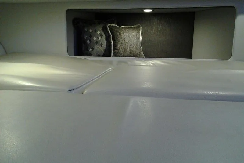 Slide: The Image of 2016 Formula 330 Crossover Bowrider, sleek white deck, open windshield, spacious seating. - 19