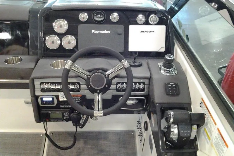 Slide: The Image of 2016 Formula 330 Crossover Bowrider storage compartment with open lid, showcasing interior space. - 23