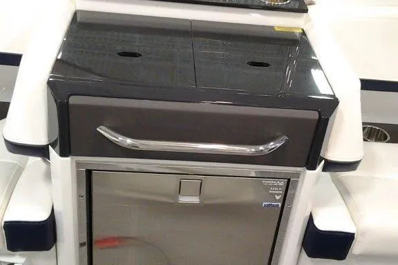 Slide: The Image of Interior of 2016 Formula 330 Crossover Bowrider with TV, speaker, and control panel. - 25