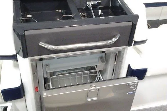 Slide: The Image of 2016 Formula 330 Crossover Bowrider interior with sink, countertop, and blue LED lighting. - 26