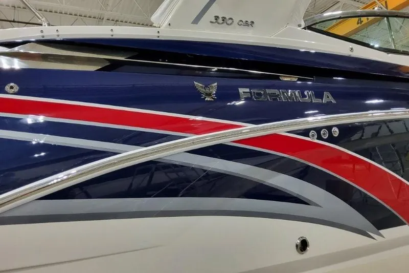 Slide: The Image of 2016 Formula 330 Crossover Bowrider interior with white cushioned seating. - 29