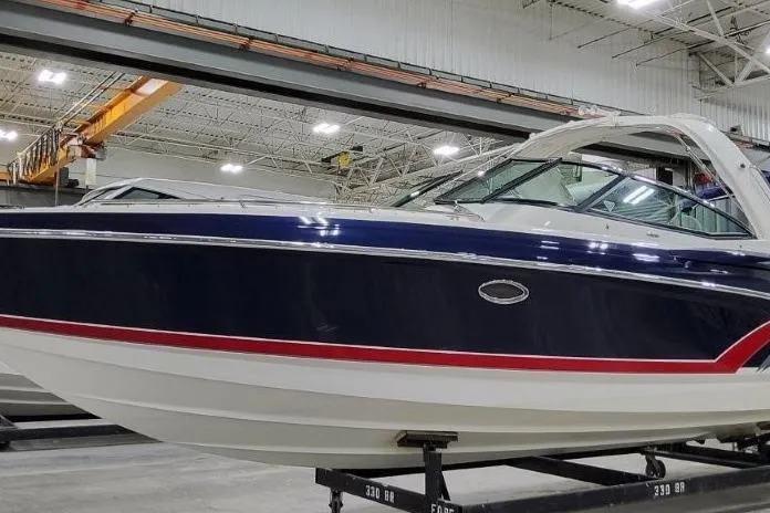 Slide: The Image of 2016 Formula 330 Crossover Bowrider interior with white seating and cup holders. - 33