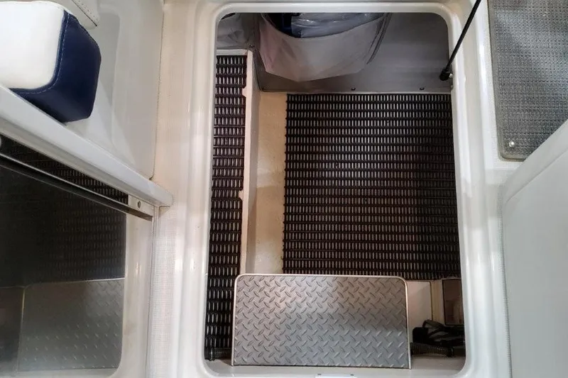 Slide: The Image of 2016 Formula 330 Crossover Bowrider interior with spacious white seating area. - 36