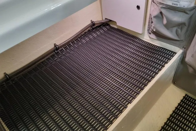 Slide: The Image of Wooden steps inside 2016 Formula 330 Crossover Bowrider boat, featuring sleek design and carpeting. - 37