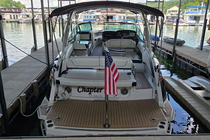 Slide: The Image of 2016 Formula 330 Crossover Bowrider dashboard with steering wheel and navigation controls. - 4