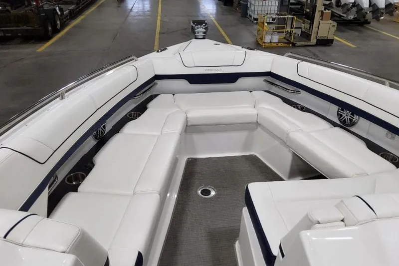 Slide: The Image of 2016 Formula 330 Crossover Bowrider interior seating with white leather upholstery. - 40