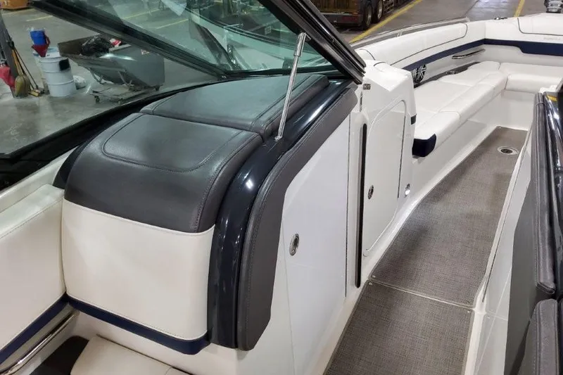 Slide: The Image of 2016 Formula 330 Crossover Bowrider interior with white leather seating and speaker. - 42