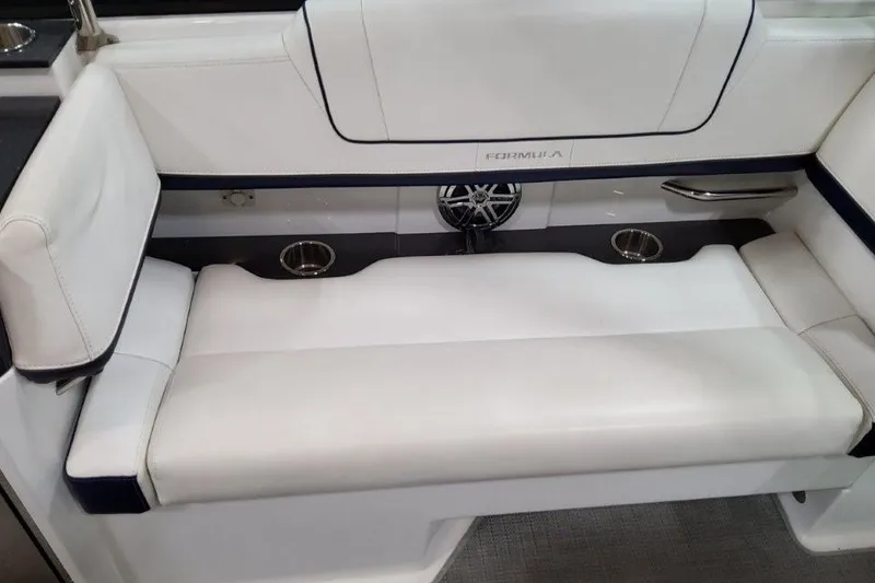 Slide: The Image of 2016 Formula 330 Crossover Bowrider interior with built-in storage and cup holders. - 43