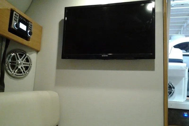 Slide: The Image of 2016 Formula 330 Crossover Bowrider dashboard with Raymarine navigation system and gauges. - 5