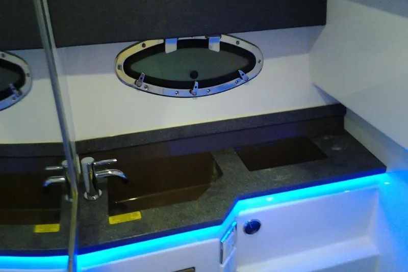 Slide: The Image of 2016 Formula 330 Crossover Bowrider helm with controls and cup holder. - 6