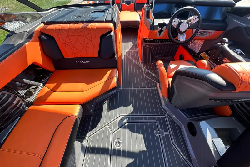Slide: The Image of 2022 Nautique Super Air Nautique G25 Paragon interior with orange seating and sleek design. - 2