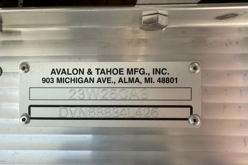 Slide: The Image of Metal plate with Avalon & Tahoe MFG details, including address and serial numbers. - 11
