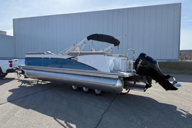 Slide: The Image of 2025 Tahoe 2385 pontoon boat with Suzuki outboard motor on trailer. - 3