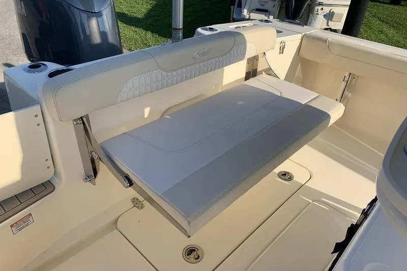 Slide: The Image of 2026 Scout 215 XSF boat interior with beige seating and modern design. - 12