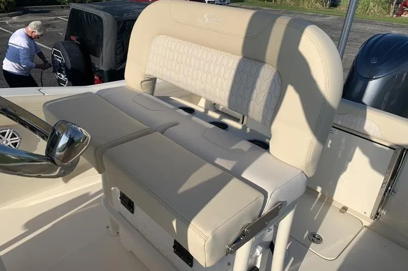 Slide: The Image of 2026 Scout 215 XSF boat interior with beige seating and steering wheel. - 18