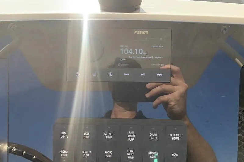 Slide: The Image of Dashboard of 2026 Scout 215 XSF boat with radio and control panel. - 22