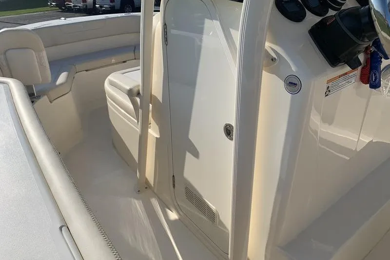 Slide: The Image of 2026 Scout 215 XSF boat interior with seating and control panel. - 25