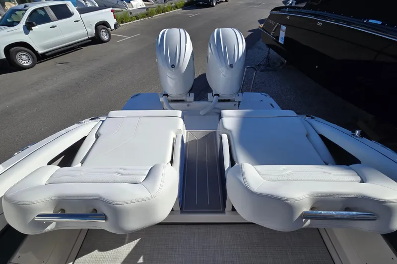 Slide: The Image of 2026 Regal LX9 boat with dual engines and luxurious white seating. - 2