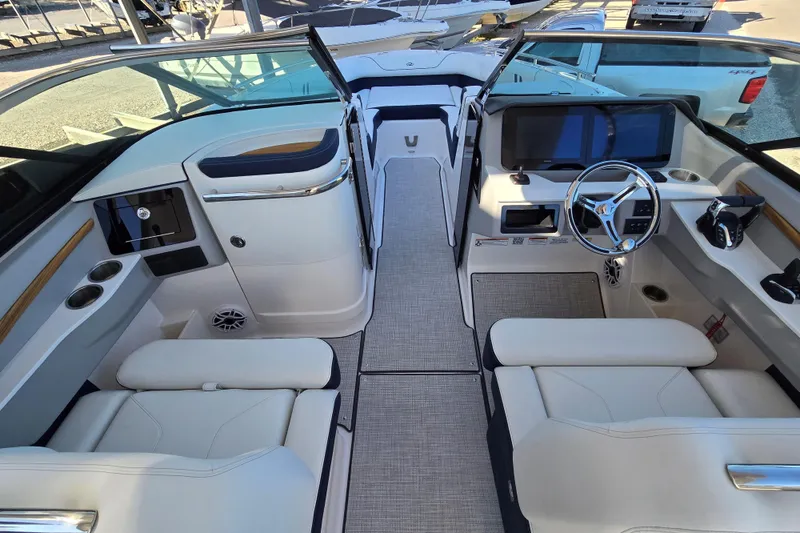 Slide: The Image of Luxurious interior of 2026 Regal LX9 boat with modern dashboard and comfortable seating. - 4