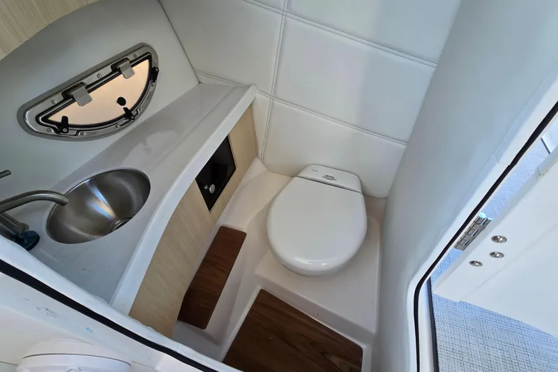 Slide: The Image of Compact bathroom in 2026 Regal LX9 boat with sink and toilet. - 7
