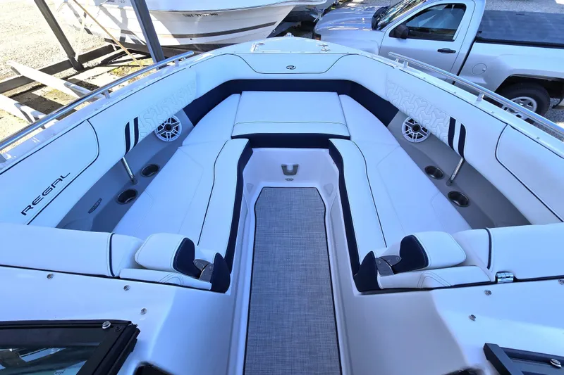 Slide: The Image of 2026 Regal LX9 boat interior with white seating and modern design. - 8