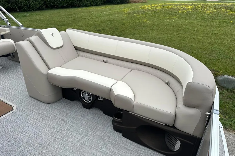 Slide: The Image of Luxurious seating on 2025 Tahoe 2385 boat, featuring plush beige upholstery and modern design. - 14