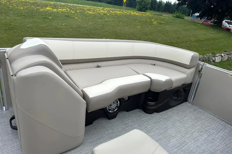 Slide: The Image of Luxurious seating on 2025 Tahoe 2385 pontoon boat, featuring plush, curved design. - 16